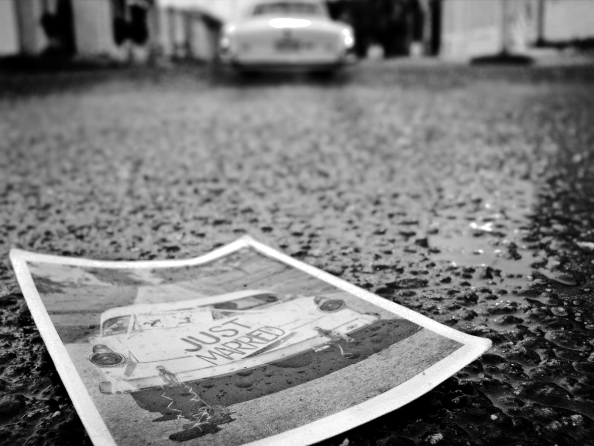 Photo laying on the ground showing a bride and groom